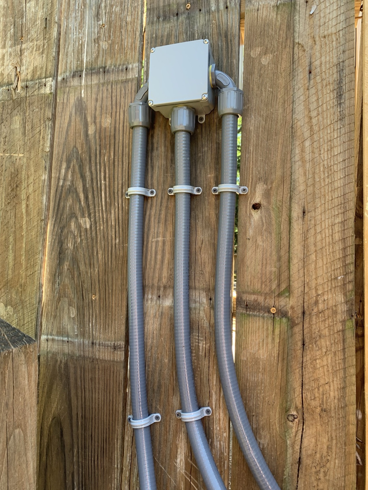Three precisely aligned exterior conduit runs